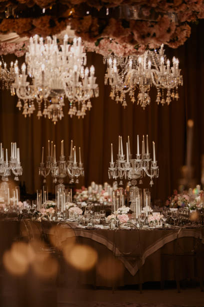 istock Beautiful table setting for family Christmas dinner. Cozy atmosphere, candlelight on tall candelabras. stock photo 2158957069