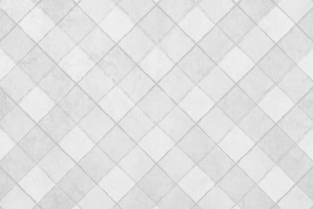 Light grey white coloured matte dull all over criss cross tiled pattern over textured horizontal vector backgrounds with crisscross design made by connected rhombus shapes grid of tiles Light gray white coloured matte dull all over criss cross pattern over textured horizontal vector backgrounds with crisscross design made by connected rhombus shapes grid all over. Apt to use as a backdrop, gift wrapping paper sheet, posters template, wallpaper. tiled floor stock illustrations