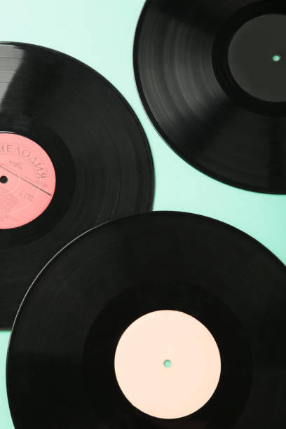 istock Gramophone vinyl records on mint background. Vertical photo 2158957364