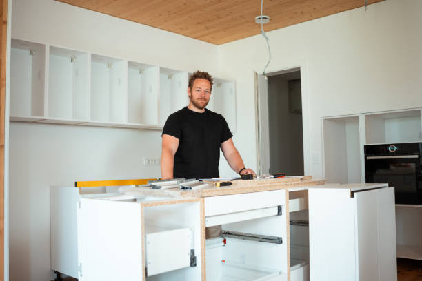 istock Caucasian Man Building Kitchen Furniture 2158960117