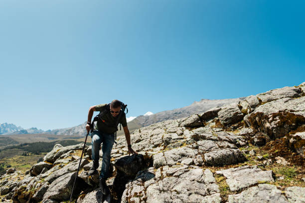 Mid adult man doing a trail on a Laguna Radian, Peru