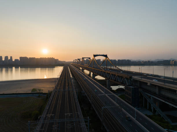 Hanoi, Vietnam - January 6, 2013: A kid plays at near Long Bien bridge acrossing Red River in Hanoi, Vietnam