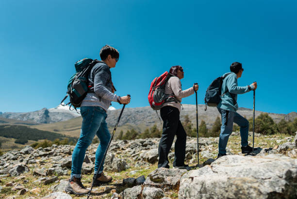 istock Friends doing a trail on a Laguna Radian, Peru 2158963259