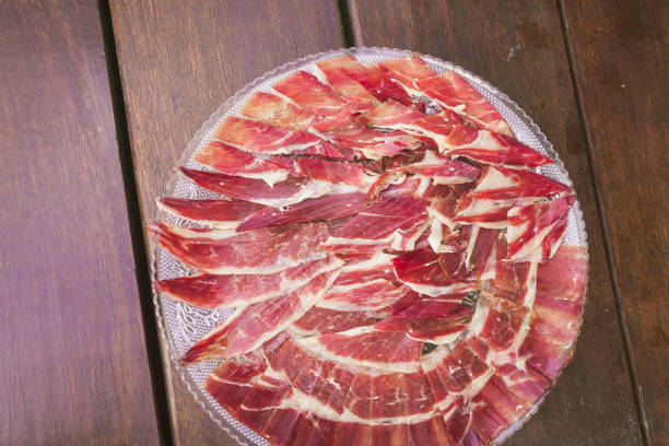 istock A plate of meat is on a wooden table 2158964173