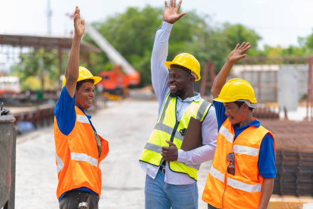 istock Foreman worker team making high hands over head, Success and Teamwork Concepts 2158964545