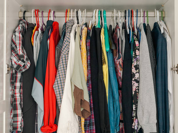 istock wardrobe with hanging clothes, filled wardrobe, storing clothes at home, saving space 2158964555