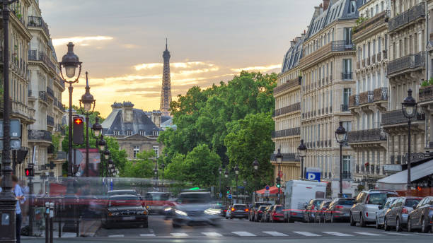 istock Sun setting behind a building on a Parisian Soufflot street timelapse with Eiffe tower on background 2158964661