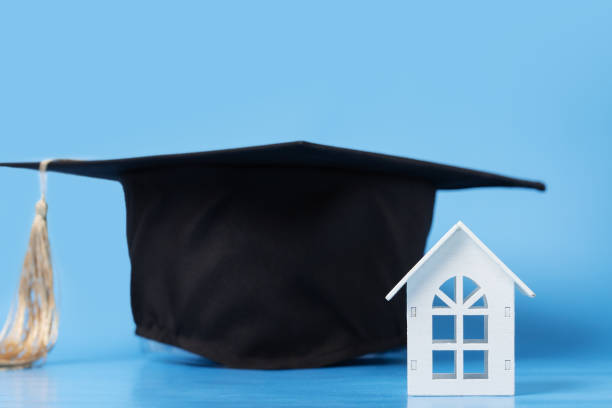 istock Graduation cap and house, student studying remote learning, university degree celebration 2158964793