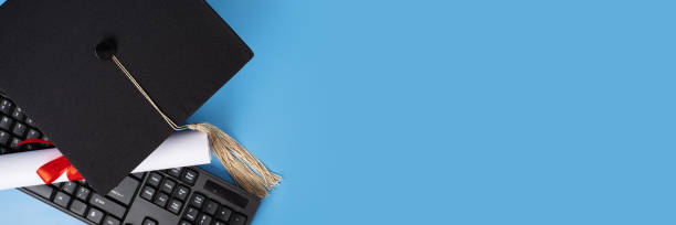 istock Online education banner, graduation cap and keyboard, high school student studying, laptop-based education, virtual graduation celebration 2158964800