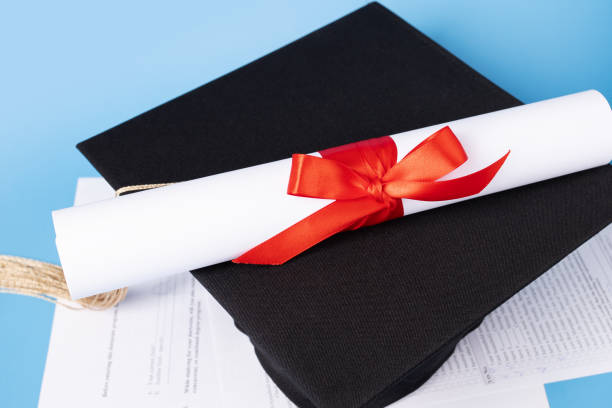 istock Education documents, graduation cap and exam papers, student studying at university, degree celebration, academic ceremony 2158964847
