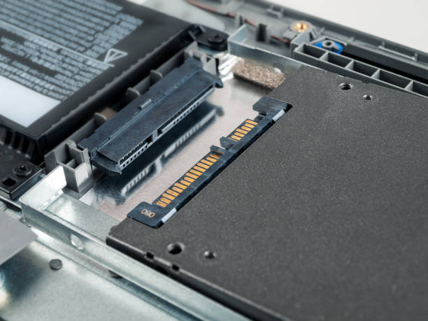 istock hard drive ssd drive in laptop, replacement repair increase, close-up 2158965869