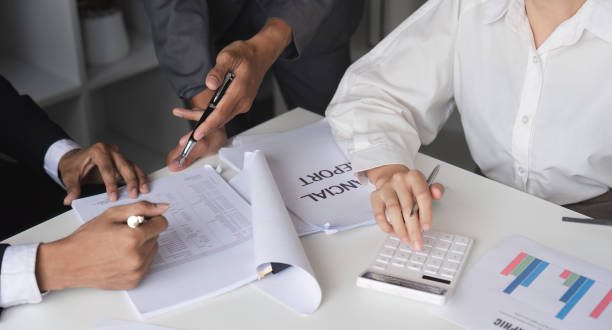 istock Business Team Collaborating on Financial Reports and Ideas in a Modern Office Setting 2158967030