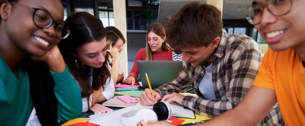 istock Multiracial group of university students at campus concentrated studying together. 2158969509