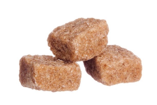 istock Brown cane sugar cubes isolated on white background 2158971681