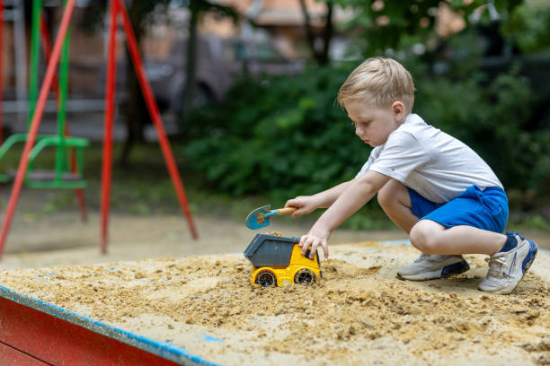 istock A little boy playing in a sandbox in the summertime 2158971791