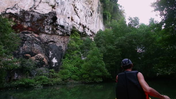 Free picture: People in a boat on a river surrounded by cliffs, Vietnam