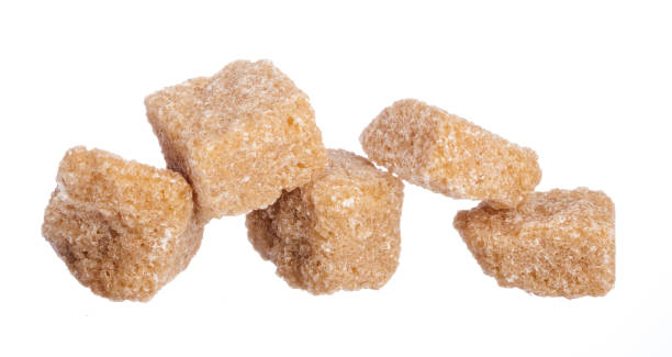 istock brown sugar cubes isolated on white background 2158973245