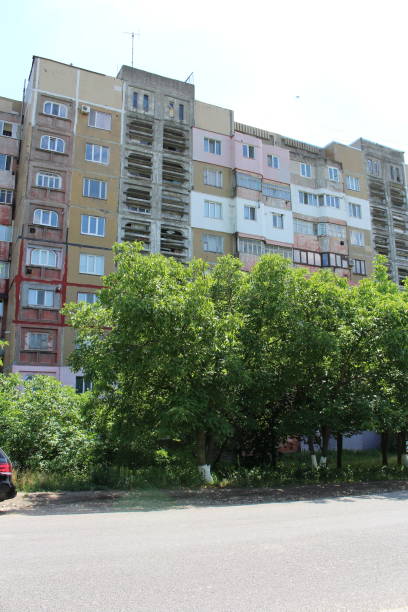istock A group of trees in front of a building 2158973660