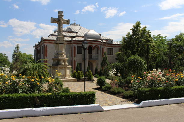 A large white house with a garden in front of it