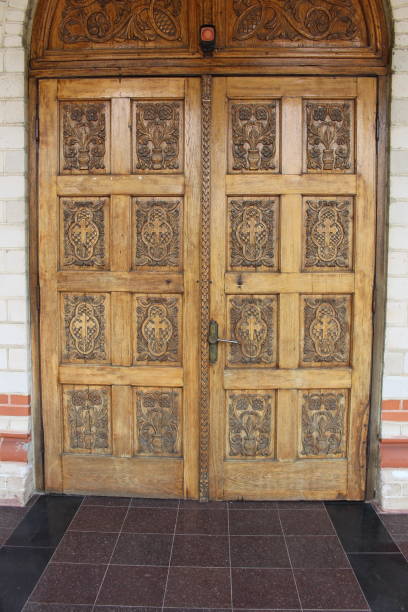 istock A wooden door with gold trim 2158973834
