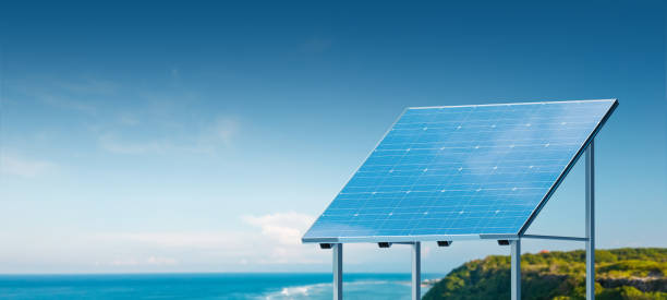 istock A solar panel on a clear day with a blue sky and ocean in the background, illustrating renewable energy. 3D Rendering 2158974396