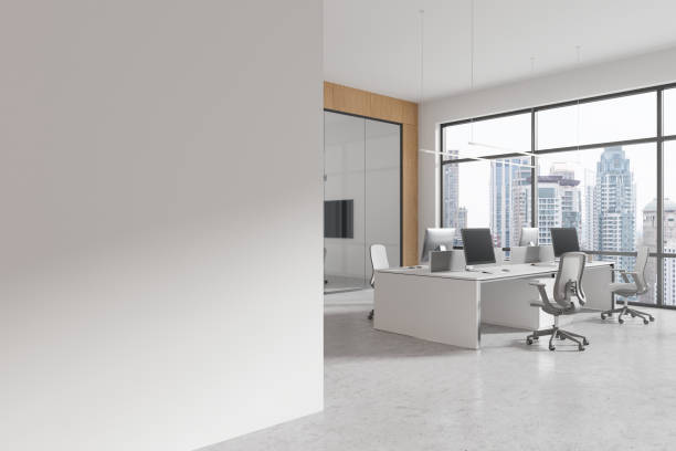 istock Spacious modern office interior with wooden elements, floor-to-ceiling windows, desks and chairs, light design style, overlooking city skyline. 3D Rendering 2158975093