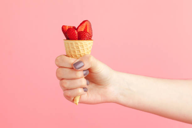 Fresh strawberry in waffle cone. Creative food concept