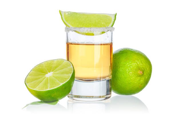 istock Gold tequila shot isolated on white background 2158975585