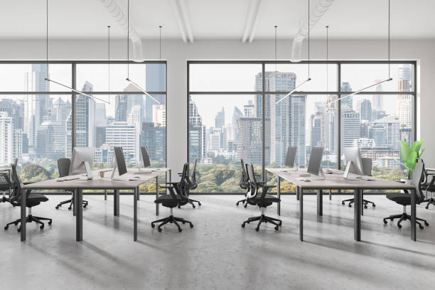 istock A modern office work space with desks, chairs, and computers cityscape background concept of corporate environment. 3D Rendering 2158975968