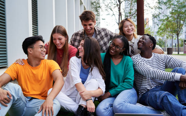 istock Multiracial group of students gathering outside university campus talking and having fun together. 2158976885