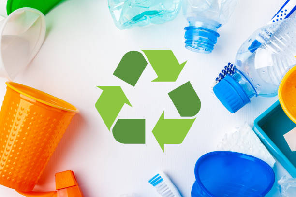 istock waste recycling eco symbol with garbage disposal on table background top 2158977007