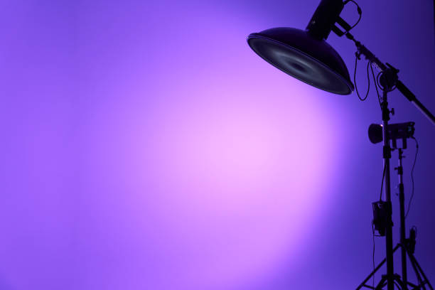 istock Portrait flash close-up. The pulsed studio flash shines with a lilac light. Professional photo equipment. With space to copy 2158977328