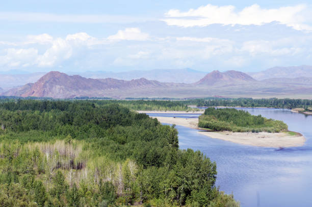istock River Yenisei flows through mountains with trees along the shore, Tuva, Russia 2158977329