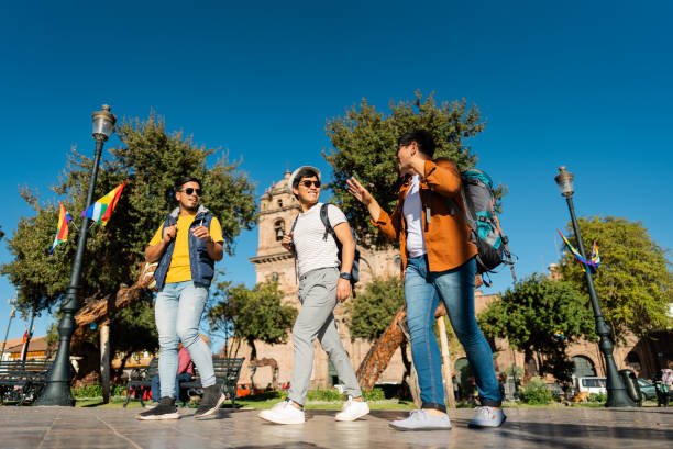 istock Male traveler friends walking and talking on Cusco, Peru 2158977451