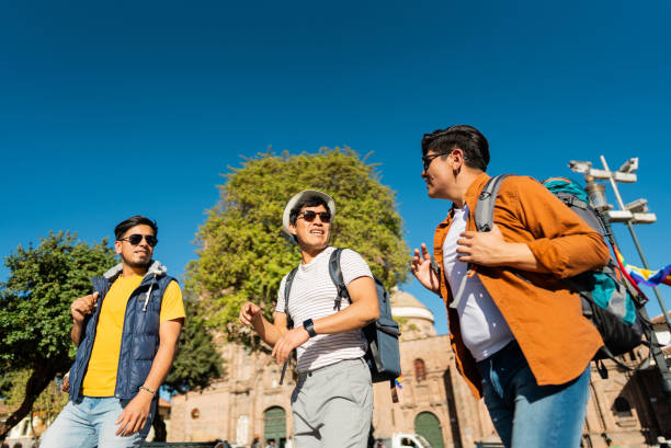 istock Male traveler friends walking and talking on Cusco, Peru 2158977453