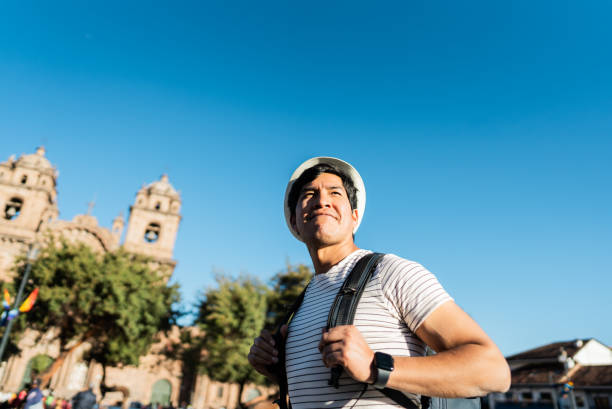 istock Mid adult traveler man walking and looking around on Cusco, Peru 2158977521