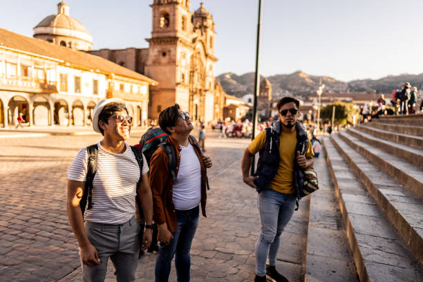 istock Male traveler friends walking and talking on Cusco, Peru 2158977594
