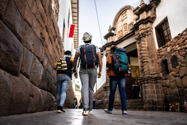 istock Male traveler friends walking and talking on Cusco, Peru 2158977649
