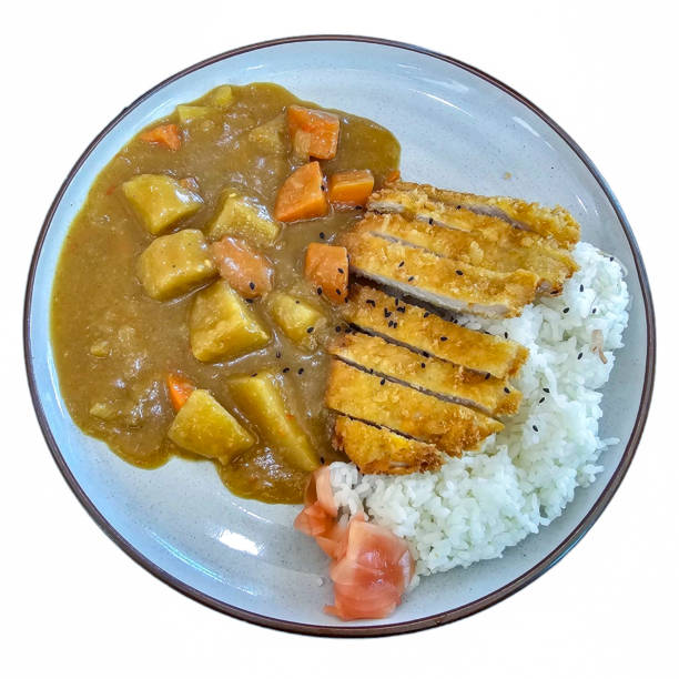 istock Fried pork curry rice with pickled ginger on the side from top view. Isolated on white background. 2158977651