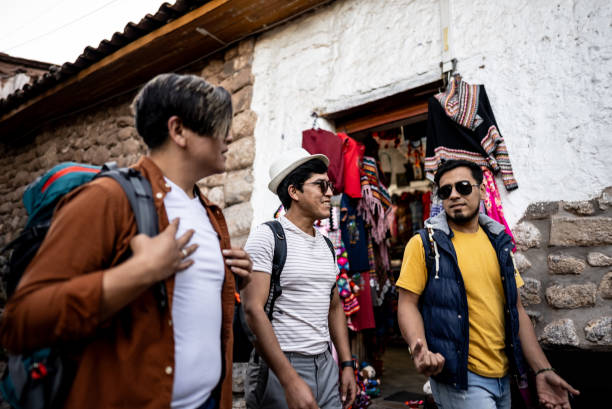istock Male traveler friends walking and talking on Cusco, Peru 2158977662