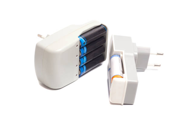 istock Rechargeable batteries in Battery Chargers isolated on white background. 2158977779