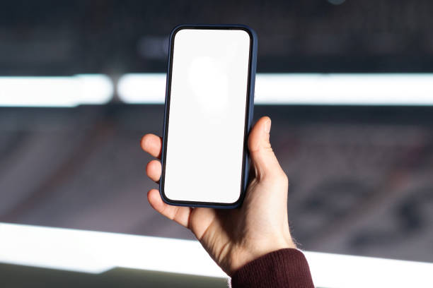 istock man's hand playing with his phone 2158977898