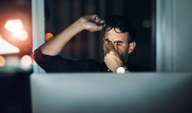 istock Eye strain, night and work at computer with business man and headache from deadline stress. Anxiety, burnout employee and brain fog from digital working for project and finance research in office 2158977929
