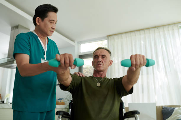 istock Asian Doctor Helping Soldier During Rehab 2158978220