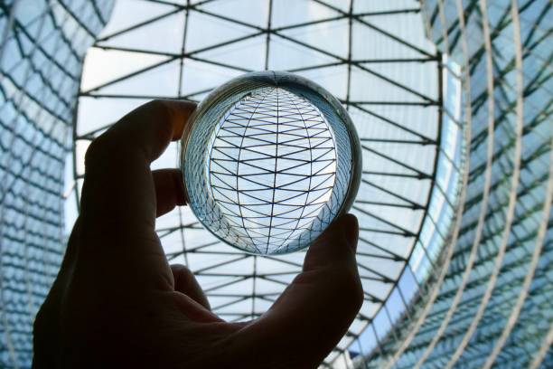 istock Crystal ball against glass ceiling 2158978569