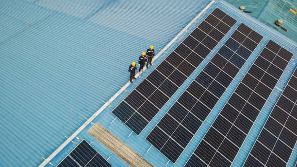 istock Aerial view of engineer worker checking on solar cell installed on the roof 2158979537