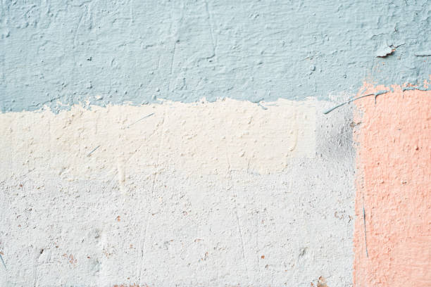 istock Fine-grained plaster applied by hand. Exterior plaster with space to copy. Warm colored background with the texture of rough grainy stone. 2158980833