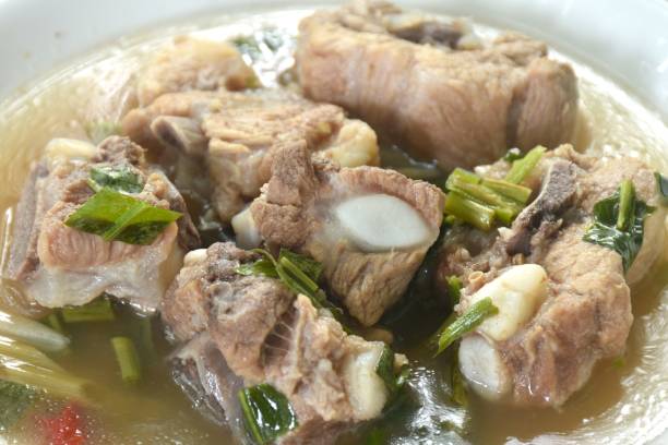 istock hot and spicy pork bone with tamarind and Thai herbs soup 2158981146