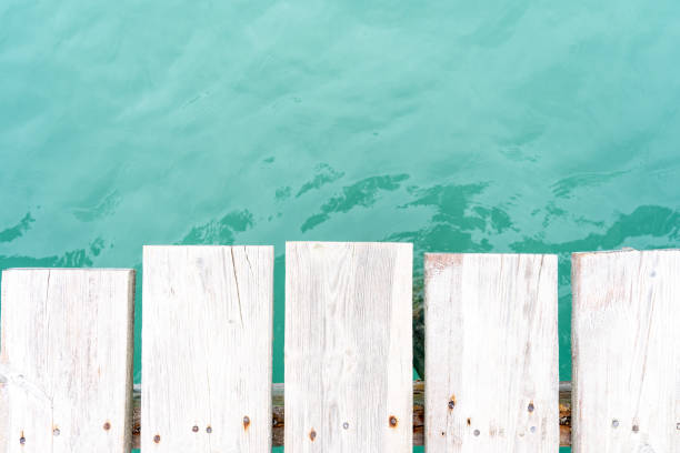 istock Wooden jetty over turquoise waters 2158981152