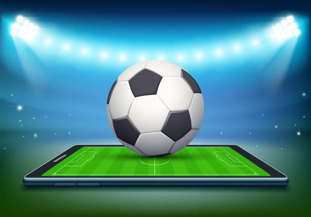 istock Smartphone with a football field and ball 2158981490